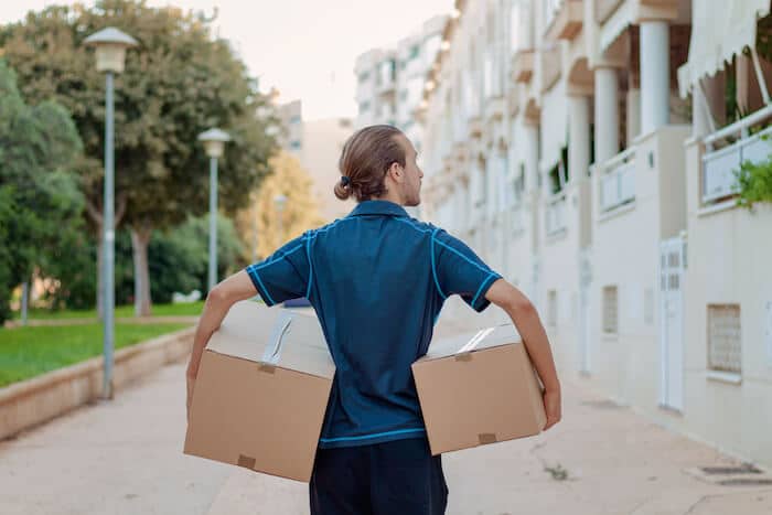 delivery man carrying boxes