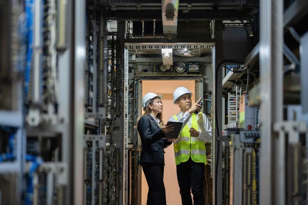 Two Mexican workers making sure the energy building is running smoothly.
