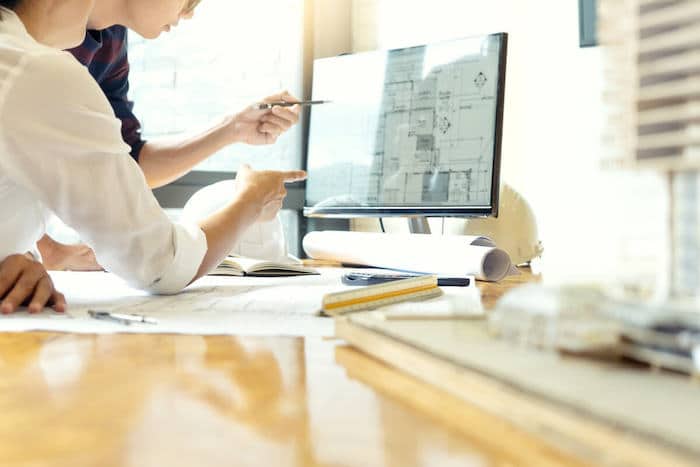 Product design steps: Engineers analyzing a project