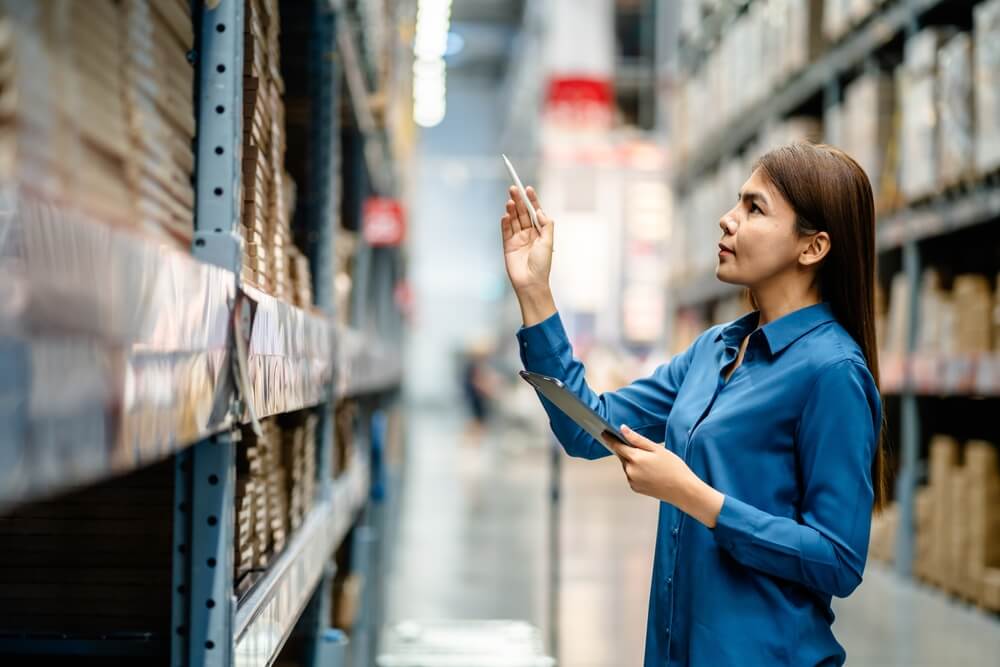 Women assessing products in the supply chain at a factory.