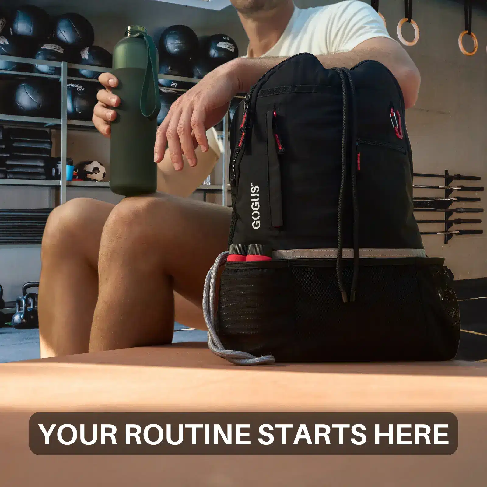 man sitting at gym next to backpack