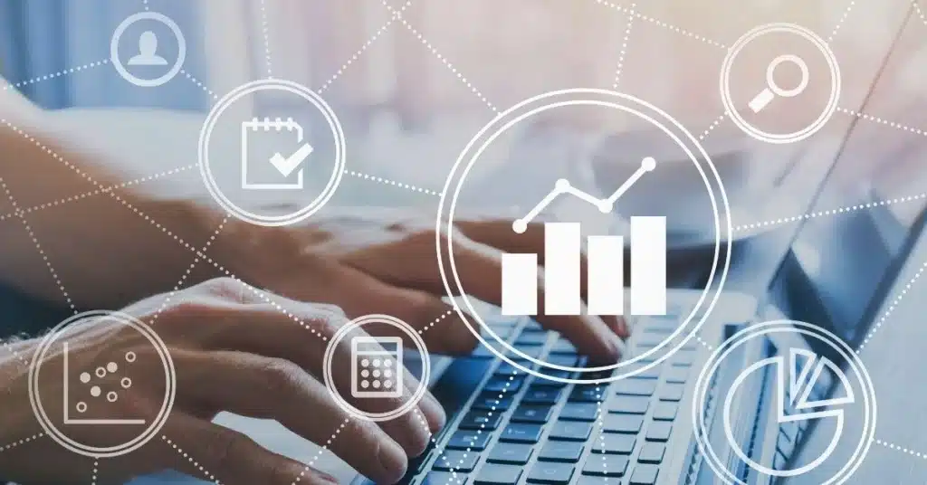 Person typing on a laptop surrounded by analytics and planning icons, illustrating Shopify Product performance tracking and optimization.