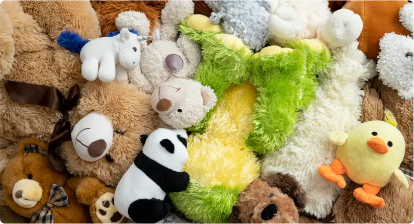 Stuffed animals in a big pile.